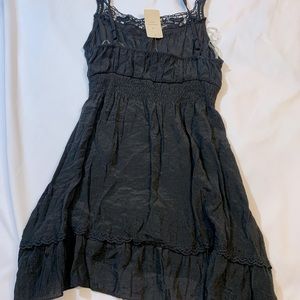 Black tank. Sheer material. Elastic waist. Crochet black